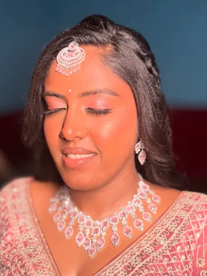 A close-up showcasing the delicate pink eyeshadow and flawless base for Vaani's reception look. This style is all about soft, romantic glamour.