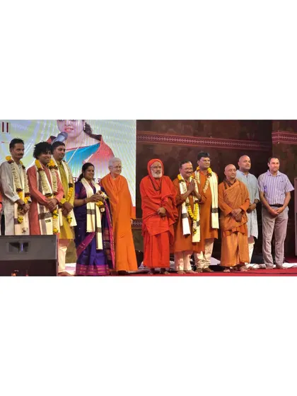 Being felicitated on stage with other artists and spiritual leaders at the 'Ekātm Parv' in Omkareshwar.