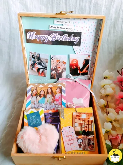 A yellow-themed hamper for your "sunflower soul" bestie. It's filled with photos, a fluffy keychain, chocolates, and a mini flip scrapbook.