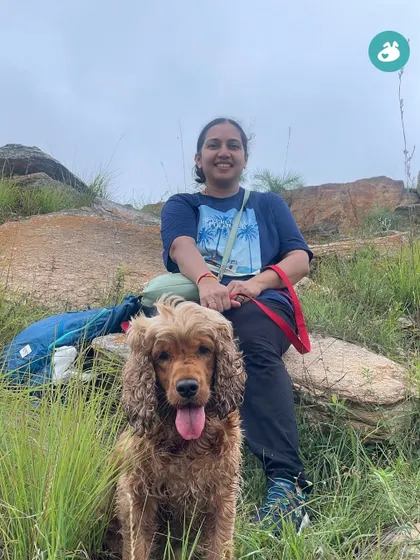 A happy Cocker Spaniel and his parent taking a break during our hike. We ensure a comfortable pace for everyone, with plenty of stops to rest and soak in the views.