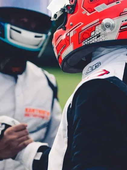A handshake between two competitors after a race, a sign of the sportsmanship and respect that is fundamental to motorsport.