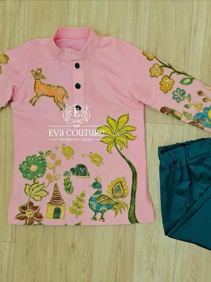 A similar hand-painted design in pink and teal. Each hand-painted kurta is unique, featuring different motifs and color combinations.