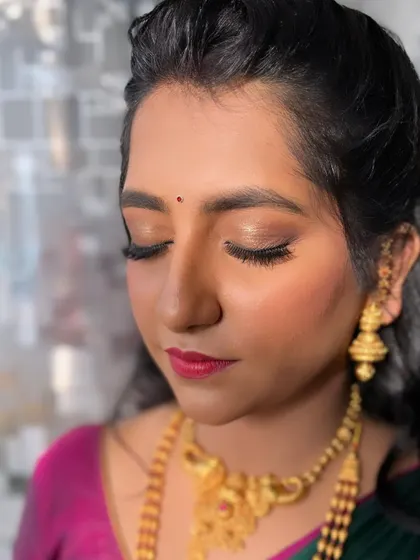 A close-up of the subtle "no-makeup" look I created for her engagement. She wanted something very simple, so I focused on a light base, soft shimmery eyes, and a natural pink lip.