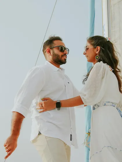A candid, loving glance between a couple on their pre-wedding yacht shoot, showcasing their natural chemistry.