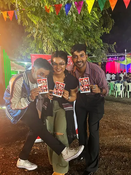 More happy faces from the Maya Bazaar. These friends are striking a pose with their prints, showing off the fun they had inside the booth. It's a simple, joyful activity that adds so much to any event.