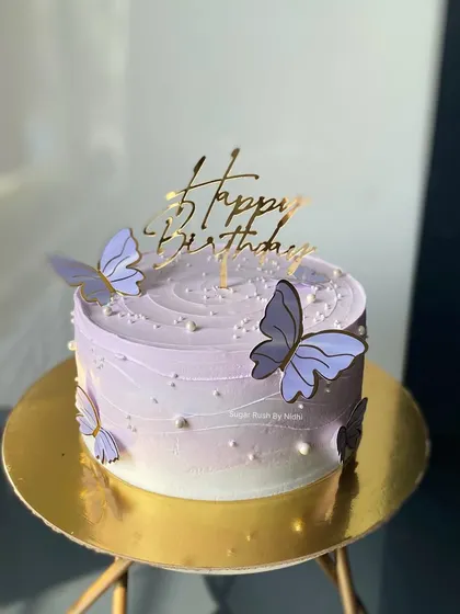 A beautiful lavender ombre cake decorated with delicate paper butterflies. This 1kg Chocolate Truffle cake is perfect for a dreamy and whimsical birthday.