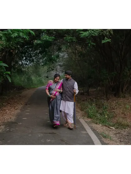 Walking hand in hand, surrounded by nature. This shot captures the feeling of a shared journey, both on the path and in life.