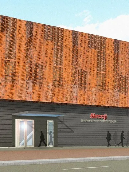 A facade design concept for an industrial building, featuring perforated panels with a Corten steel finish. This material choice provides a rugged, modern aesthetic while allowing for passive ventilation.