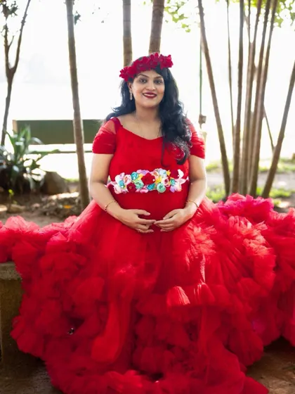 Our premium red ruffle gown makes any mom-to-be look stunning. We have a huge collection of gowns for you to choose from for your photoshoot.