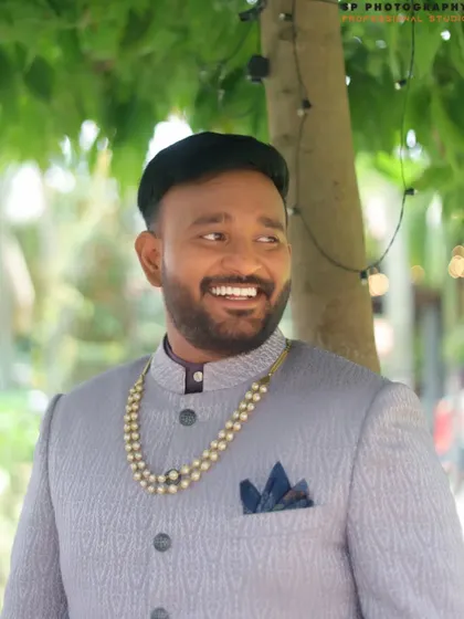 A candid and happy portrait of the groom. We make sure the groom gets his moment in the spotlight, capturing his joy and sharp attire.