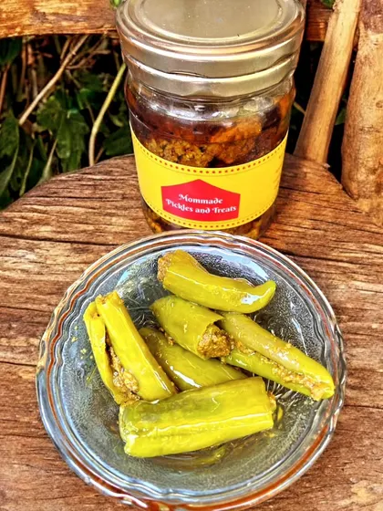 For those who love a bit of spice, I make this Stuffed Hari Mirchi Achaar. Each green chilli is carefully slit and filled with a tangy masala mix before being pickled. It has a wonderful crunch and a fiery kick that really livens up a meal.