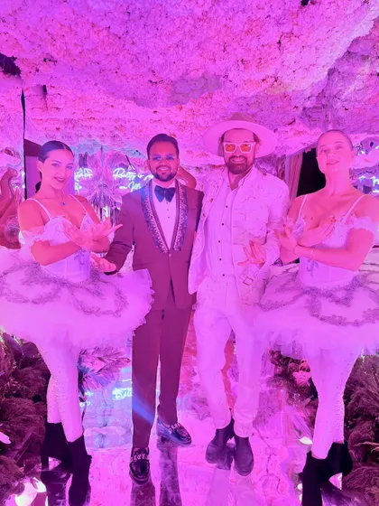 Posing with the talented performers at a glamorous cocktail night in Jaipur. The entertainment is a key part of making any sangeet or cocktail event a success.