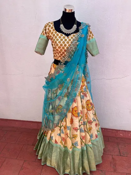 The full view of the Kalamkari lehenga, showing its beautiful flare and color combination.