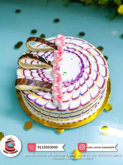 A beautiful cake with colourful marbled icing and chocolate curls. A simple yet artistic design that is perfect for any celebration.