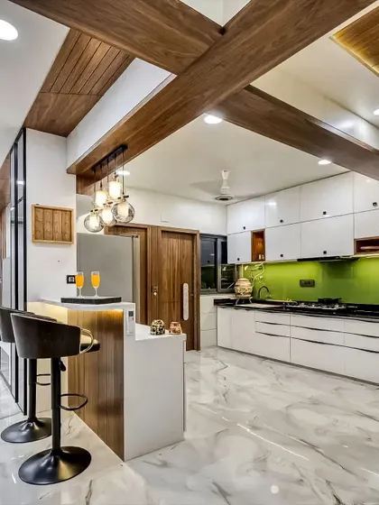 A great example of an open kitchen with a breakfast bar. The bright green backsplash adds a vibrant splash of color against the white cabinets and marble-look floor.