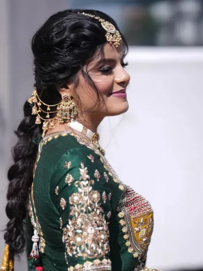 My beautiful bride ready for her carnival event in a stunning green and red outfit. The hairstyle is an intricate braid with traditional accessories.