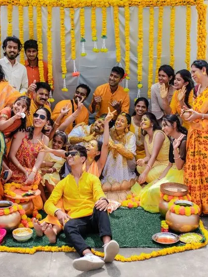 A duplicate of 135, showing the happy group at the Haldi ceremony.