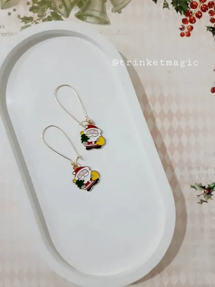 These jolly Santa hoop earrings are sure to be a conversation starter at any Christmas gathering.