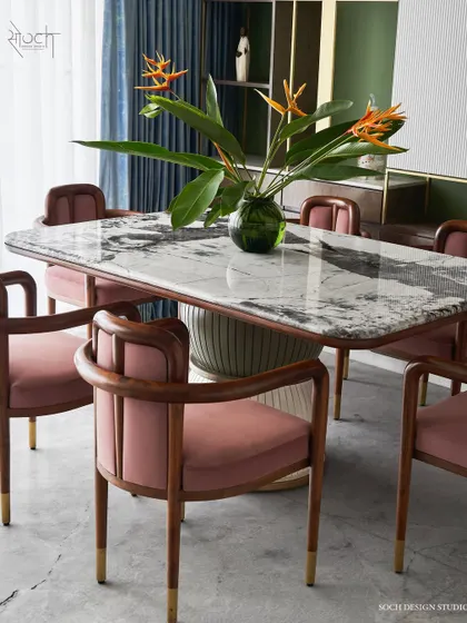 Meet the “Pellet Drum” dining table, a piece inspired by the form of Shiva’s damru. Its base features grooved spheres finished in dual-tone polyurethane, supporting a magnificent Patagonia marble top. Paired with our bent teakwood 'Svelte' chairs, this set makes every meal a statement.