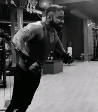 Performing a cable crossover to sculpt the chest. This exercise helps in creating definition and striations, showing my technical approach to bodybuilding.