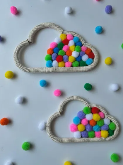 Two of my pompom cloud wall hangings, ready to be shipped out. They make a great pair for decorating a larger wall space in a nursery or playroom.
