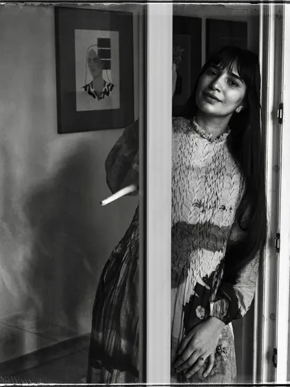 Devanshi, peeking from behind a door. Her gentle smile and the soft light make this a warm and inviting portrait from my 'Doorways' series.