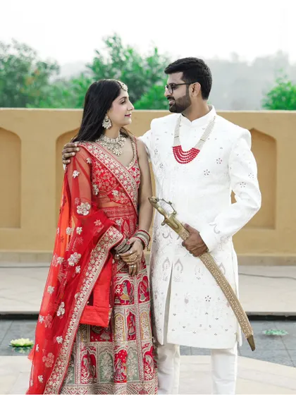 Celebrating your roots is beautiful. This portrait captures the regal elegance of traditional Indian attire. The rich colors of the lehenga and sherwani against a classic backdrop make for a truly timeless pre-wedding photograph.