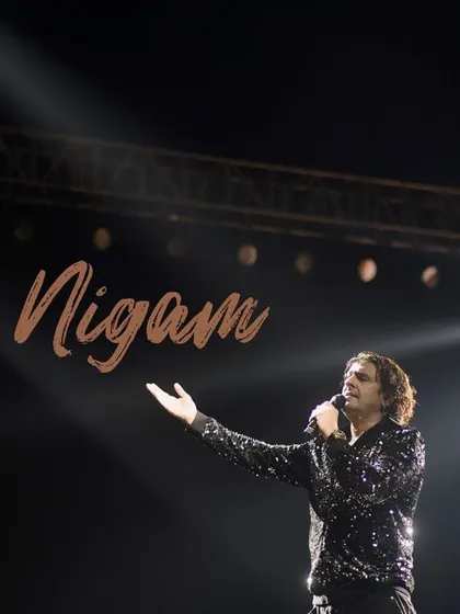 A signature shot of Sonu Nigam, framed by a powerful spotlight. This image was designed to be an iconic portrait, capturing the essence of his stage persona.