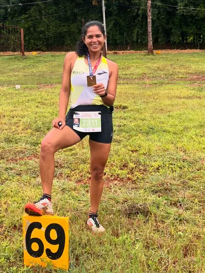 Posing with my medal after a tough trail race. The number 69 marker is just a fun coincidence! Trail running is a passion, and I love helping others discover the joy of running in nature.