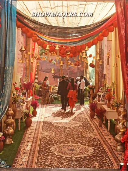 We brought the soul of Banaras to life with this vibrant and detailed entrance. The design features a rich tapestry of colors, traditional motifs, hanging temple bells, and layered fabrics, creating an authentic and culturally rich experience for a themed mehendi party.