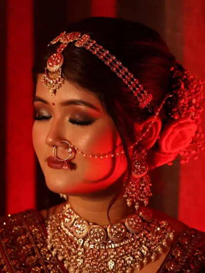 A powerful and artistic shot highlighting the bride's eye makeup. The deep, smokey look adds a touch of drama and sophistication to her wedding day glam.