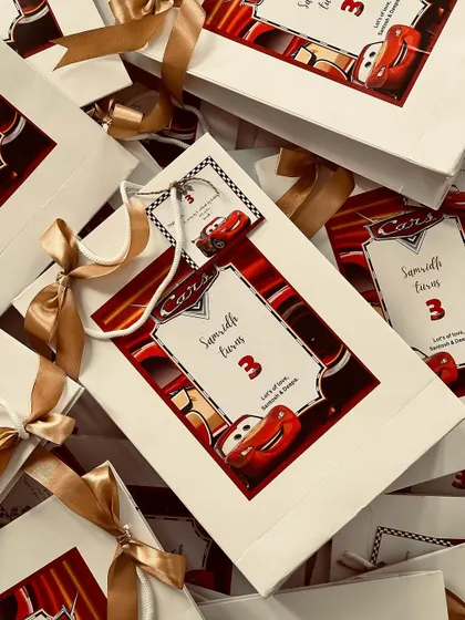 A final look at the pile of "Cars" themed return favour bags, a perfect way to end a memorable birthday party.