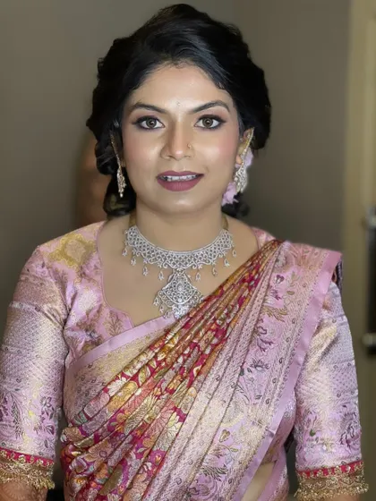 This client is glowing with confidence. The makeup is glamorous but not overpowering, a balance that I teach my students to achieve for all their clients.