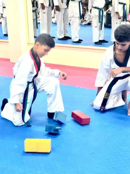 A powerful strike sends the blocks flying.