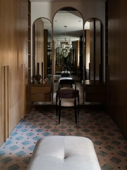 An identical shot of the walk-in closet, a space that feels like a private, high-end boutique.