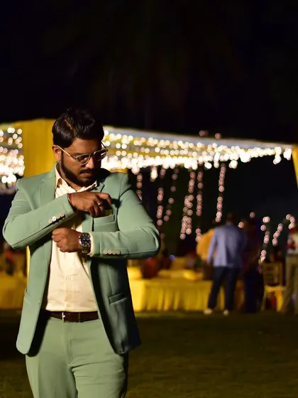 Adjust your attire, elevate your attitude. A candid moment before the event begins.