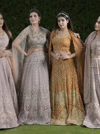 A beautiful lineup of our pastel and golden lehengas, showcasing a range of unique designs and color combinations perfect for a modern bridal party.