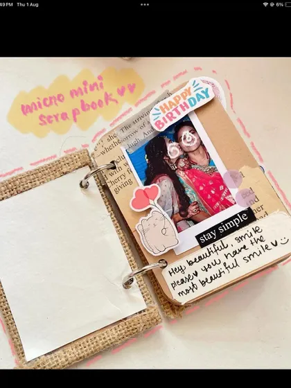 A micro-mini scrapbook for your most cherished memories. This one has a page for a birthday, complete with a photo and a sweet handwritten note. Small in size, but so big on emotion.
