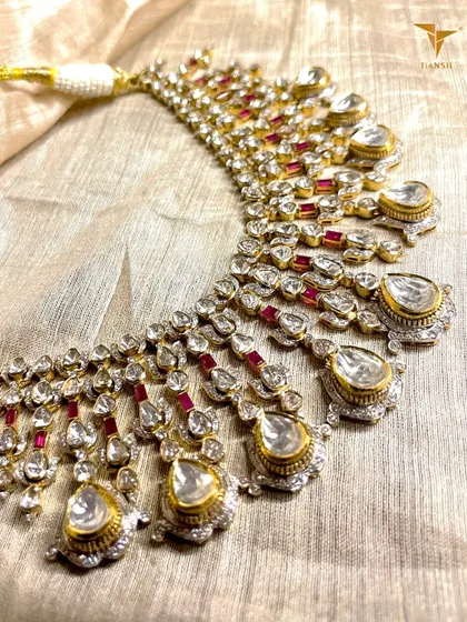 It’s giving heritage, elegance, and unapologetic grandeur. This Polki and Ruby masterpiece is not just an accessory, it is the kind of jewellery that defines your presence in a room.