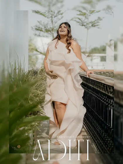 An artistic portrait of the mom-to-be, Aditi, at her baby shower. The framing and text overlay make it a beautiful announcement-style photo.