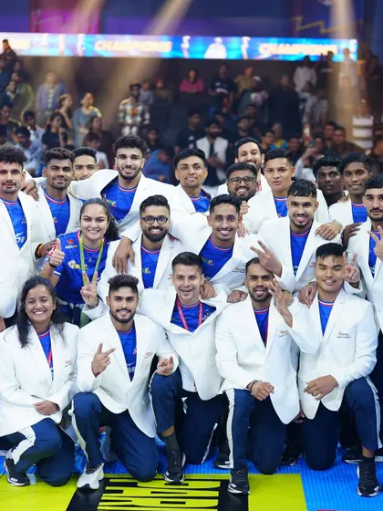 A snapshot of the winning squad. The smiles and victory signs represent countless hours of hard work, strategic planning, and unwavering team spirit.