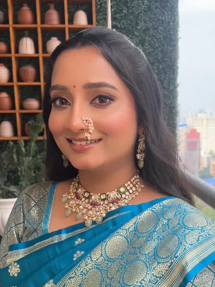A close-up of the dreamy engagement makeup for Aishwarya. The soft glam look highlights her natural beauty with a touch of radiance.