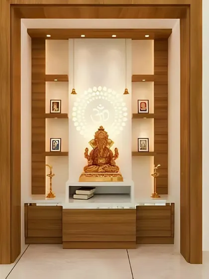 This built-in pooja niche combines a wooden frame with a pristine white backdrop. The design incorporates a backlit OM jali panel, integrated shelf lighting, and a marble-top base with drawers, offering a perfect fusion of modern aesthetics and functionality.