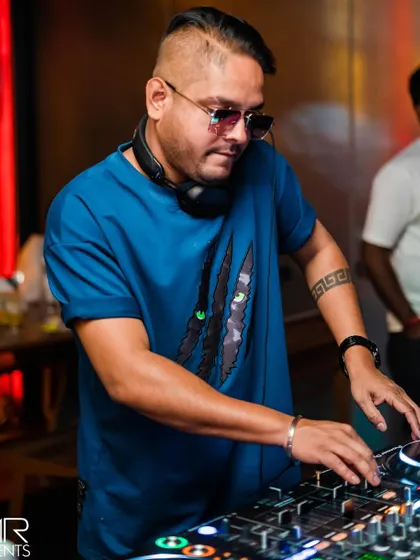 In my element, mixing tracks at The Fixx Bar. This is where I blend Bollywood melodies with hard-hitting techno beats for a unique sound.