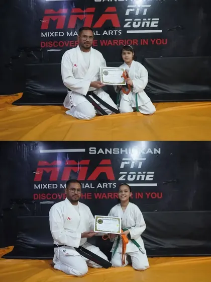 Two more of our dedicated young students being awarded their green belts. Their progress is a testament to their consistent training.