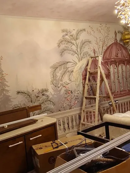 A behind-the-scenes shot of the installation in progress, showing the scale of the mural and the equipment I use to ensure a perfect application.