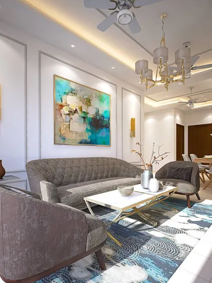 In this living room, I blended classic architectural details with modern furnishings. The walls feature traditional POP mouldings, which are complemented by contemporary abstract art, sleek furniture, and modern gold light fixtures.