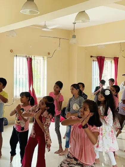 A duplicate of Image 15, this photo shows a group of children learning dance steps. Our instructors guide them through various traditional and folk movements.