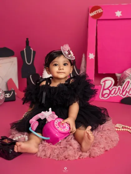 Come on Barbie, let's go party! This little fashionista is living her best life in a Barbie-themed world, complete with a pink phone and all the glamorous accessories.