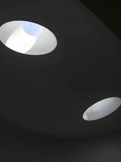 A detail of the skylights at the Vismaya museum. The abstract, sculptural quality of the openings on the roof contrasts with the soft, diffuse light they create in the galleries below.